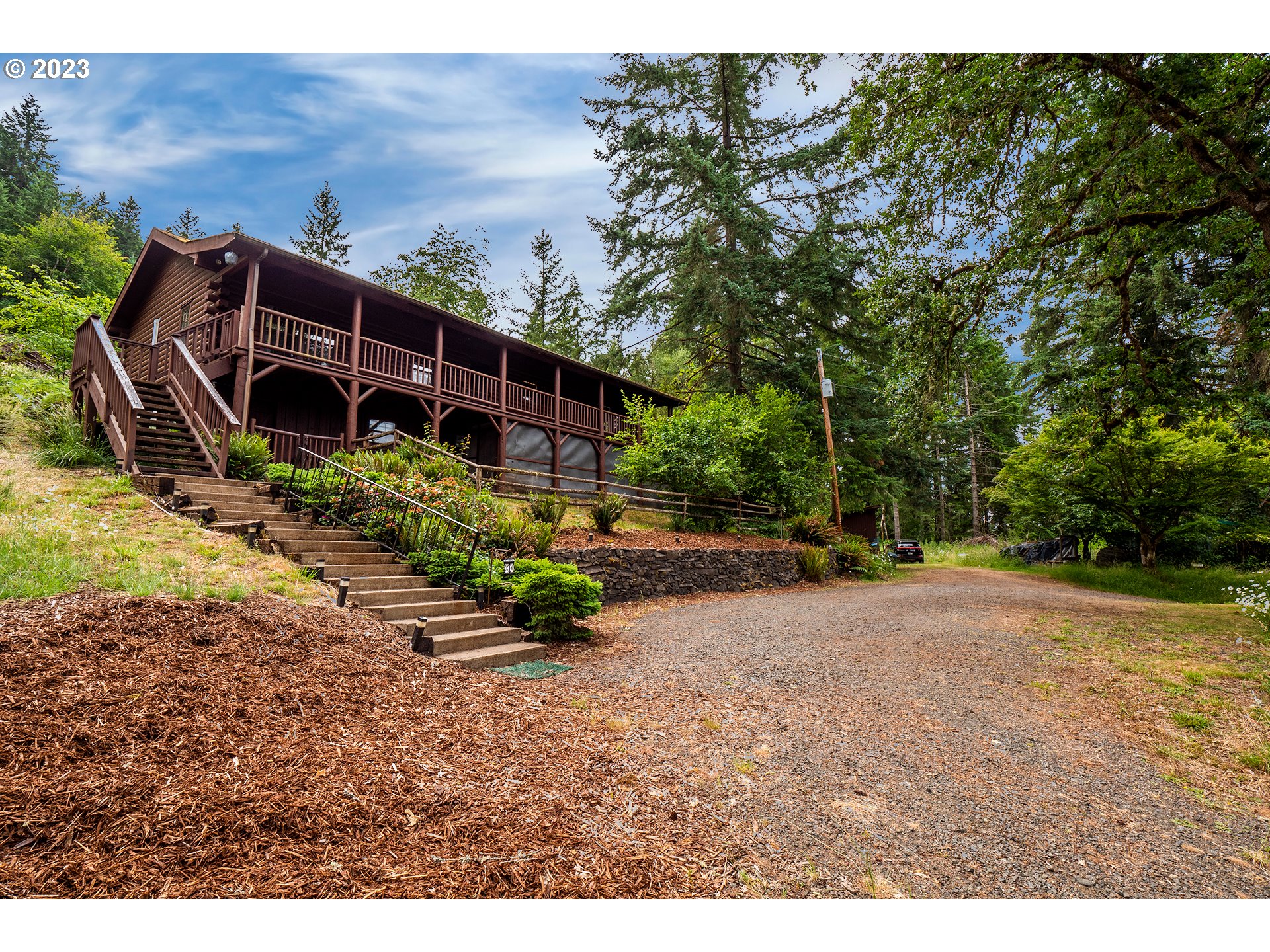 a backyard of a house with lots of green space