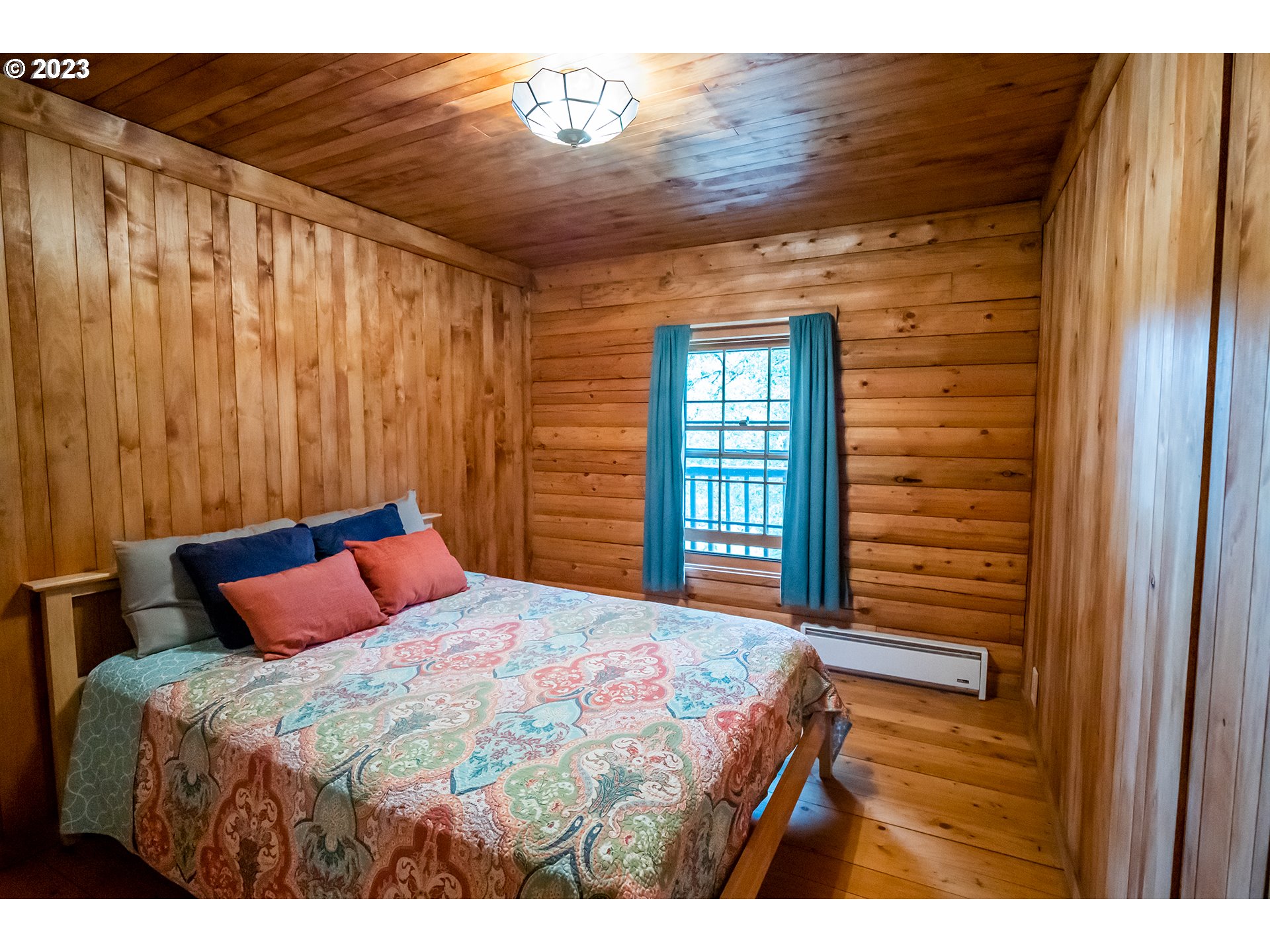 29588 Simmons Road Eugene, OR 97405 - Photo 17 of 44 a bedroom with a bed and a window