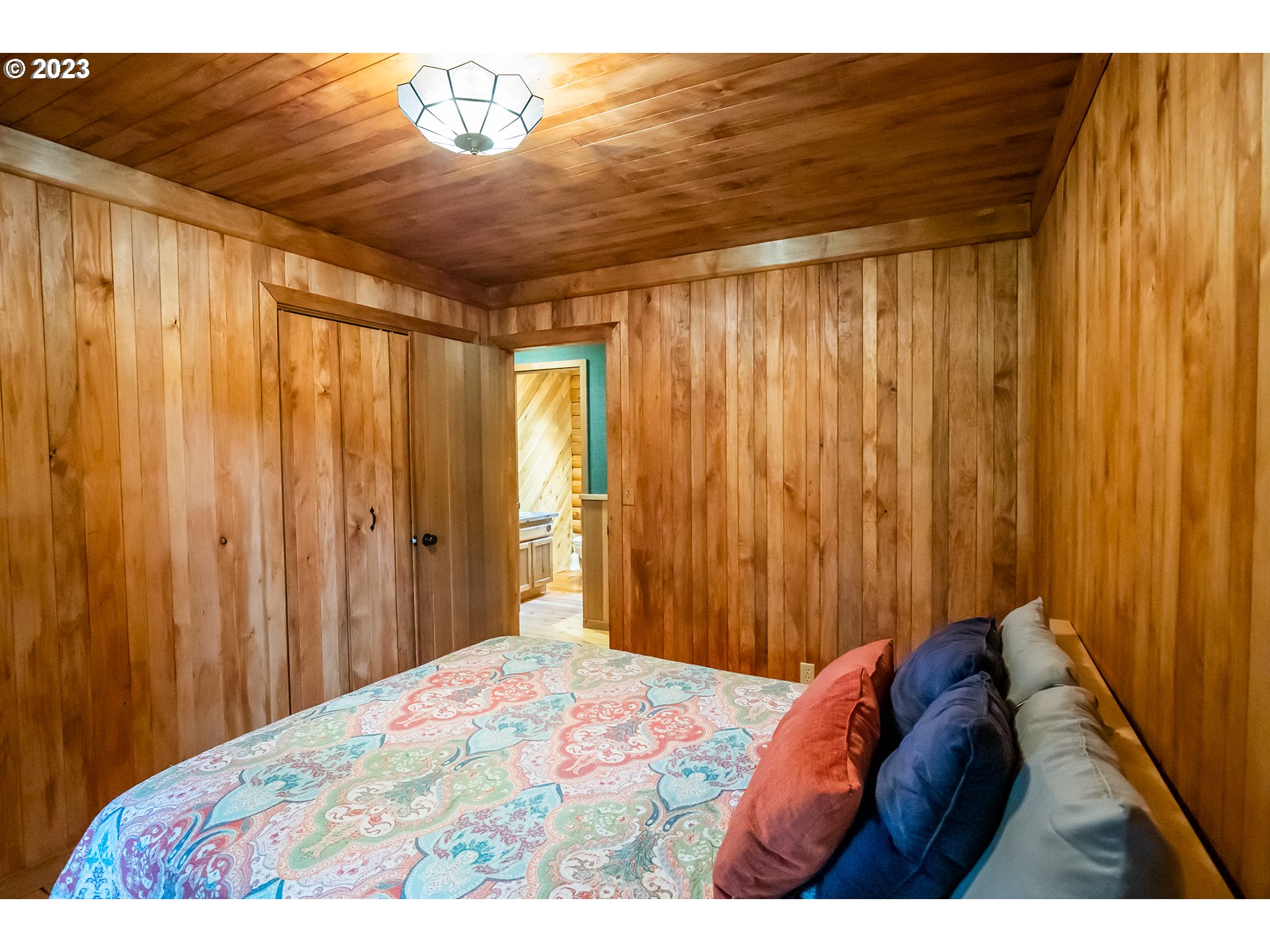 29588 Simmons Road Eugene, OR 97405 - Photo 18 of 44 a bedroom with a bed and curtain