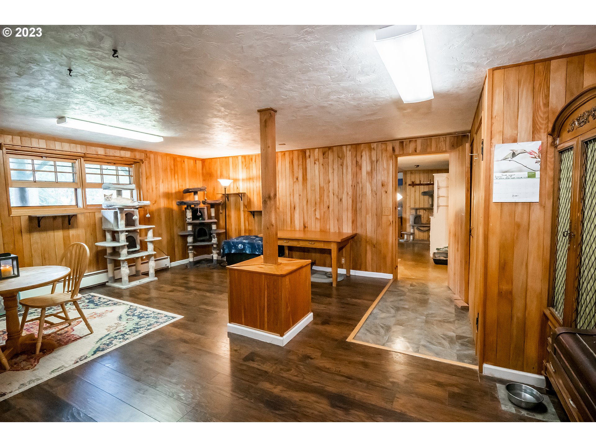 29588 Simmons Road Eugene, OR 97405 - Photo 20 of 44 a living room with furniture a large window and wooden floor