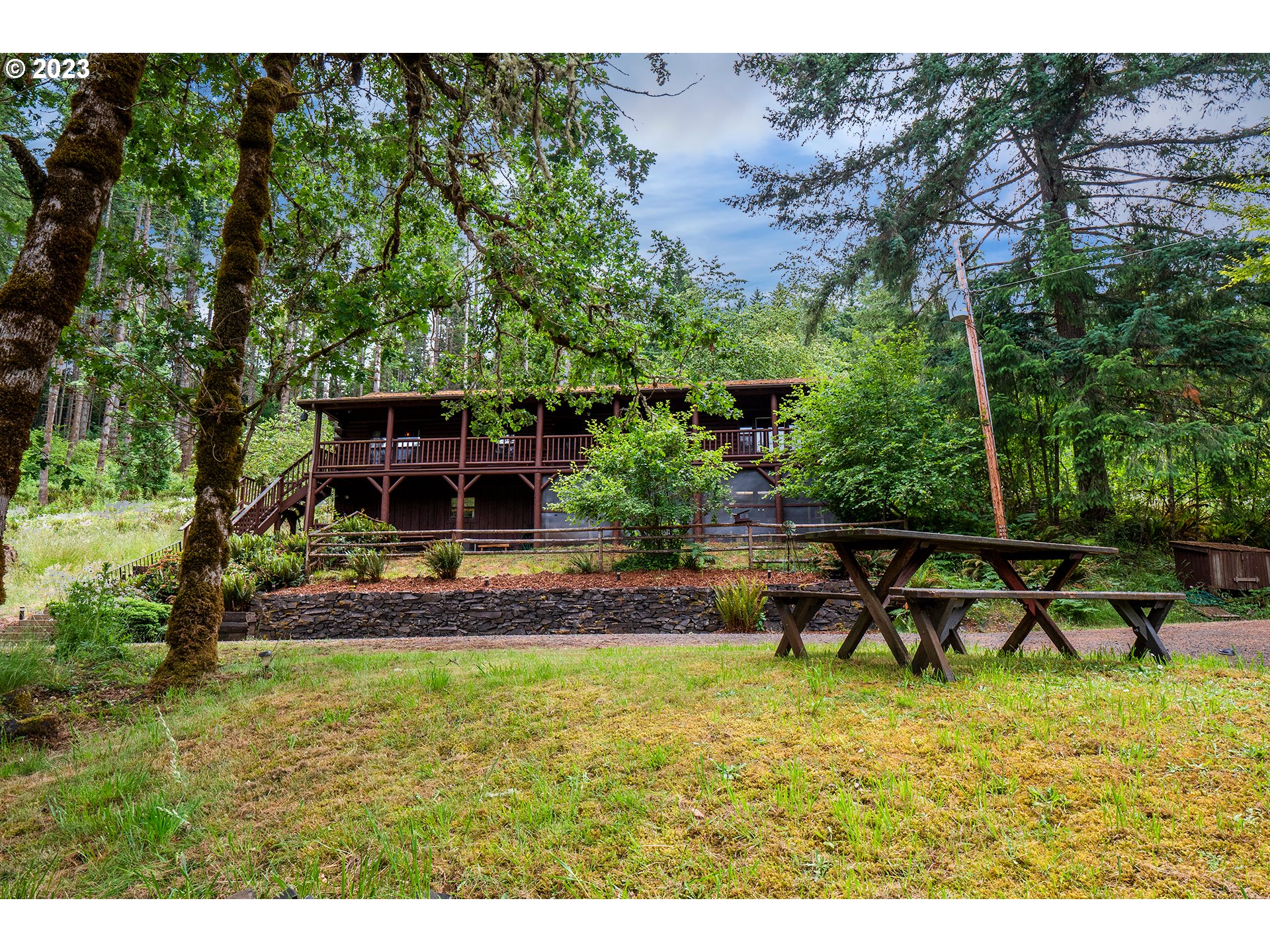 29588 Simmons Road Eugene, OR 97405 - Photo 2 of 44 a view of a house with backyard sitting area and garden