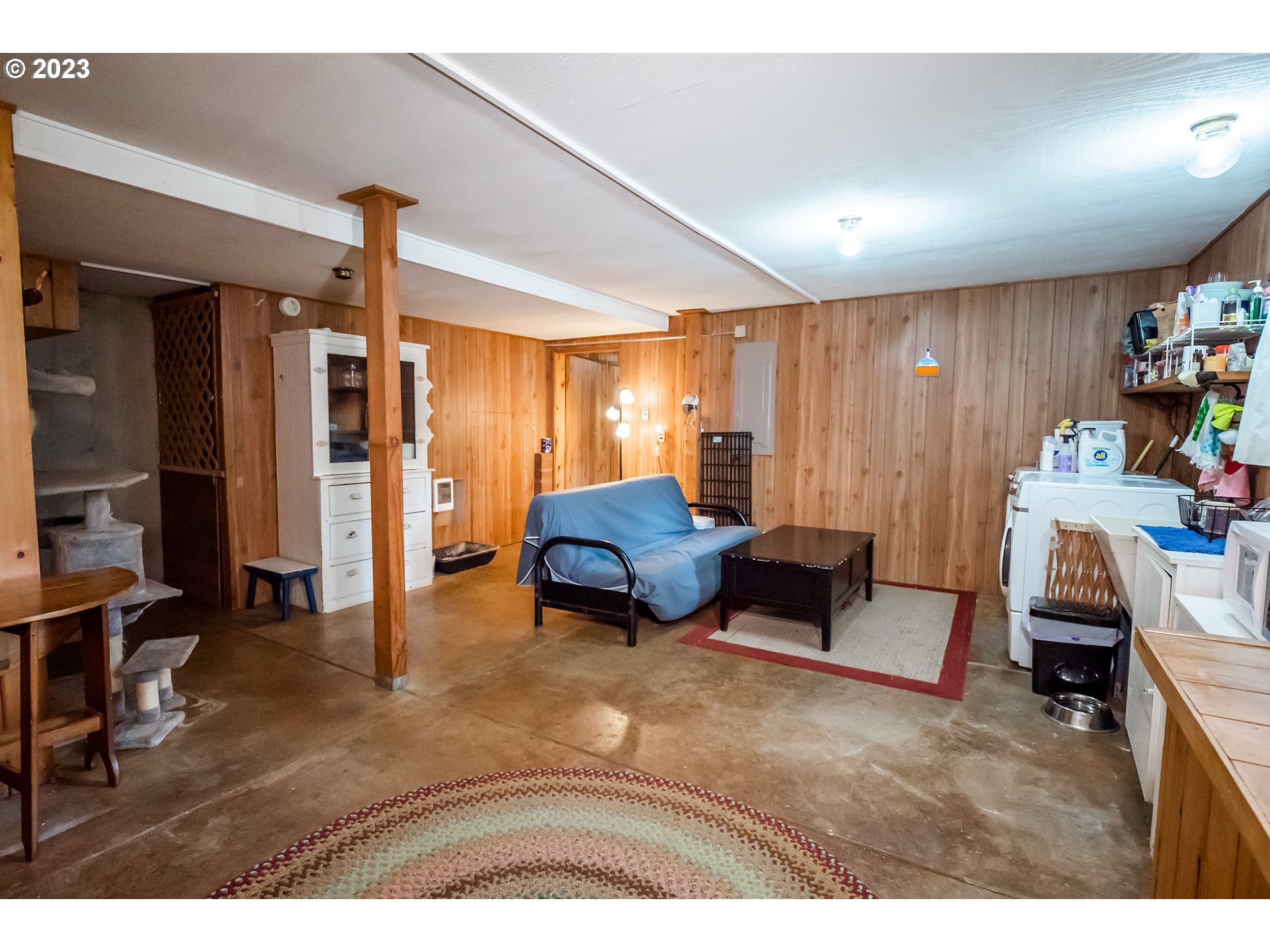 29588 Simmons Road Eugene, OR 97405 - Photo 23 of 44 a living room with furniture and a wooden floor