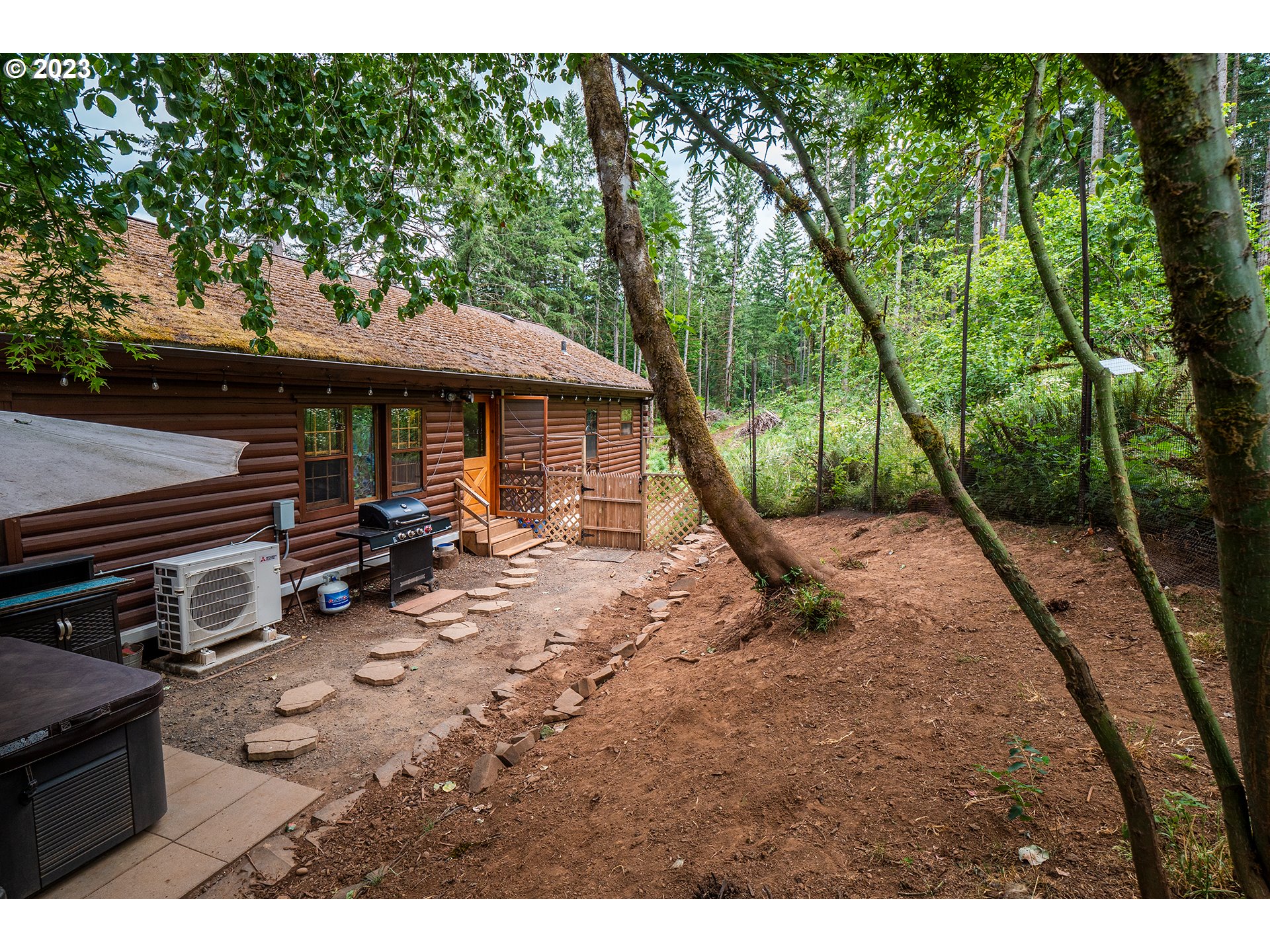29588 Simmons Road Eugene, OR 97405 - Photo 27 of 44 a view of a sitting area with furniture and wooden deck