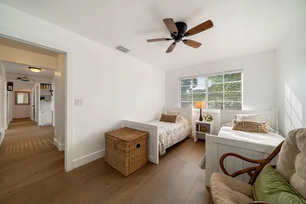 a balcony with furniture and wooden floor