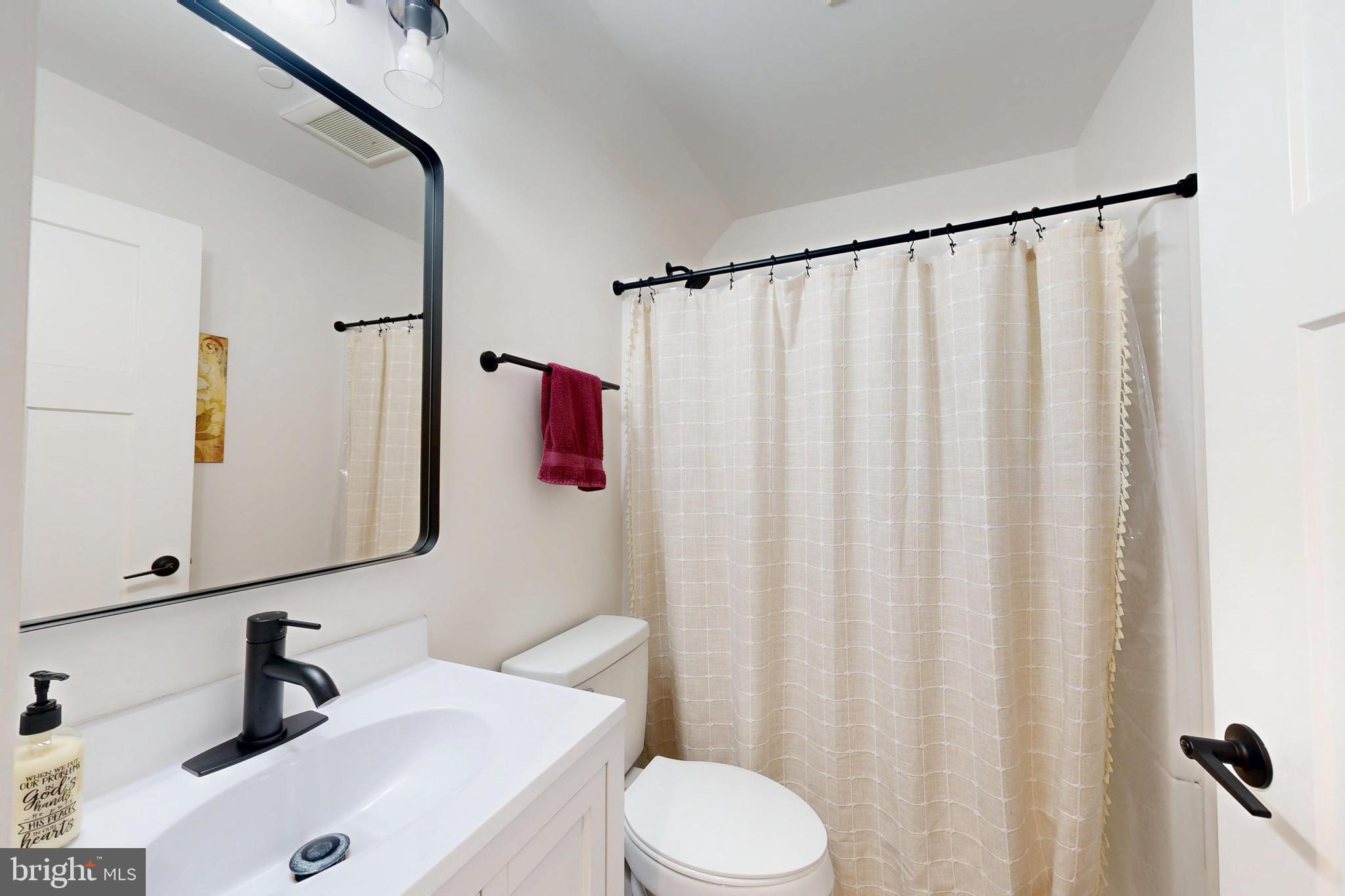 23730 Henry Road Ridgely, MD 21660 - Photo 22 of 28 a bathroom with a sink and a mirror