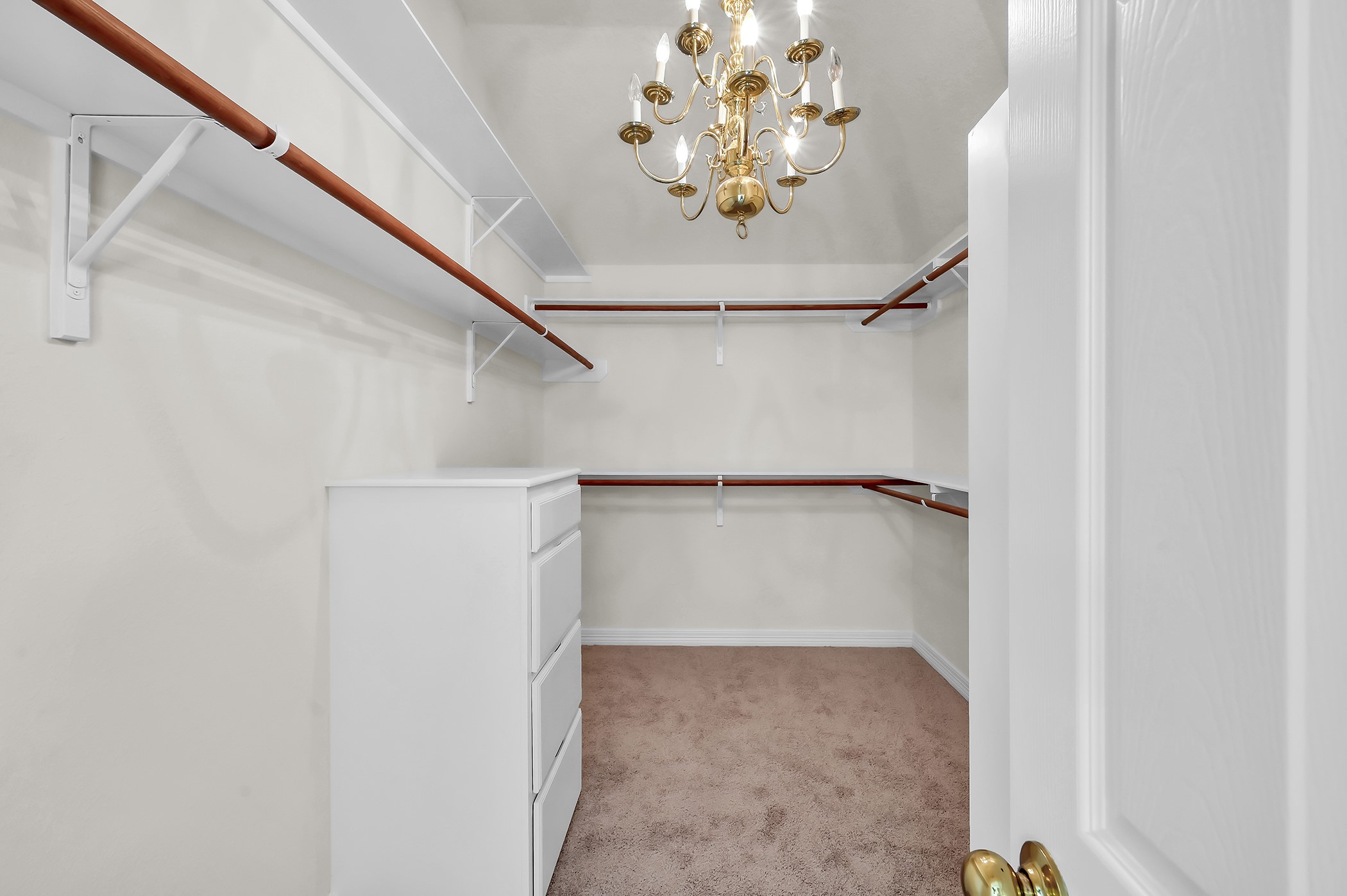 18310 Rittenhouse Park Court Spring, TX 77379 - Photo 19 of 35 Primary closet features fresh paint, new carpet and great built-in storage.