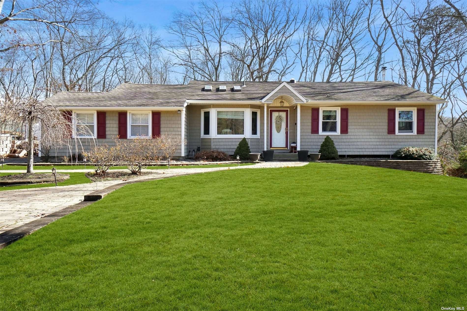 79 Wyandanch Boulevard Smithtown, NY 11787 - Photo 1 of 1 a front view of a house with a yard