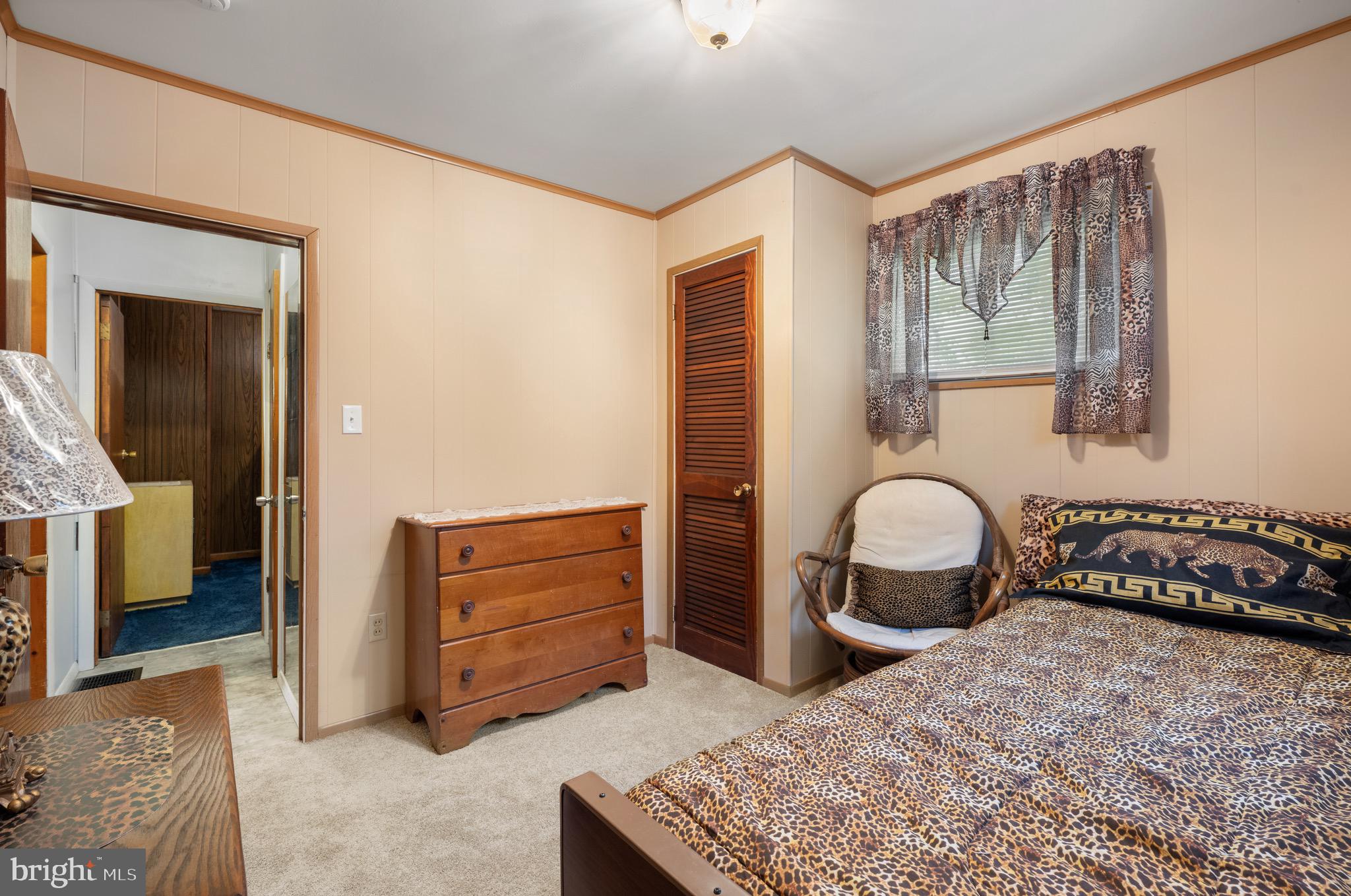 302 Tyler Avenue Carneys Point, NJ 08069 - Photo 18 of 27 a bedroom with a bed and a dresser