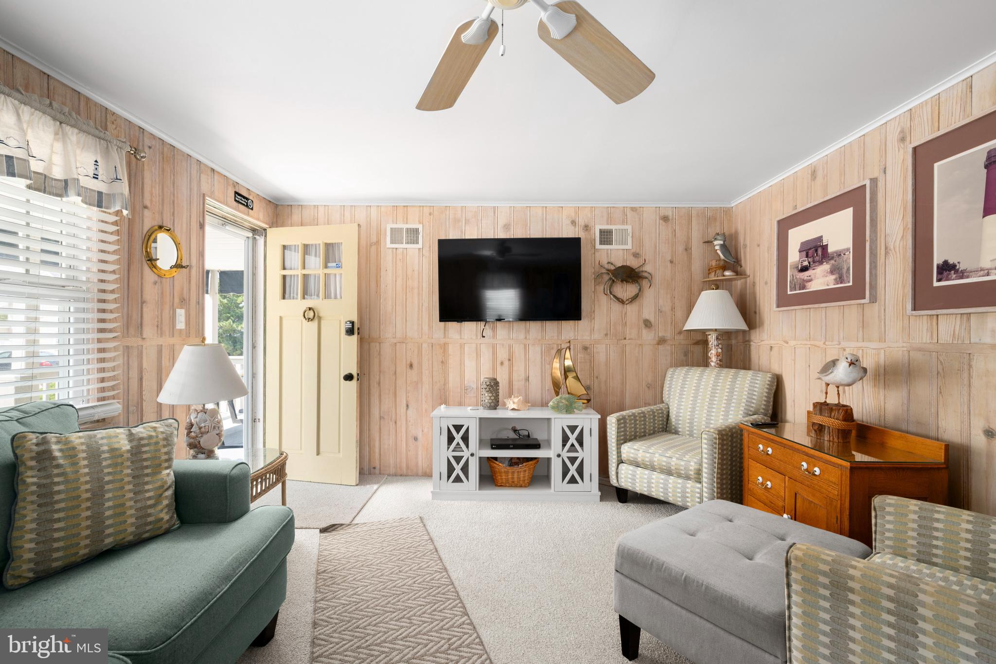 33 19th Street Surf City, NJ 08008 - Photo 11 of 63 a living room with furniture and a flat screen tv