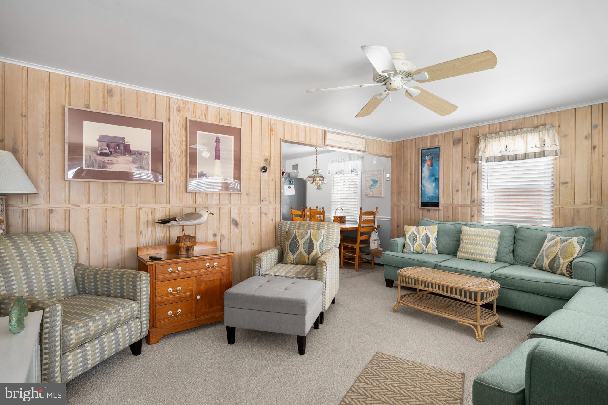 33 19th Street Surf City, NJ 08008 - Photo 12 of 63 a living room with furniture and a large window