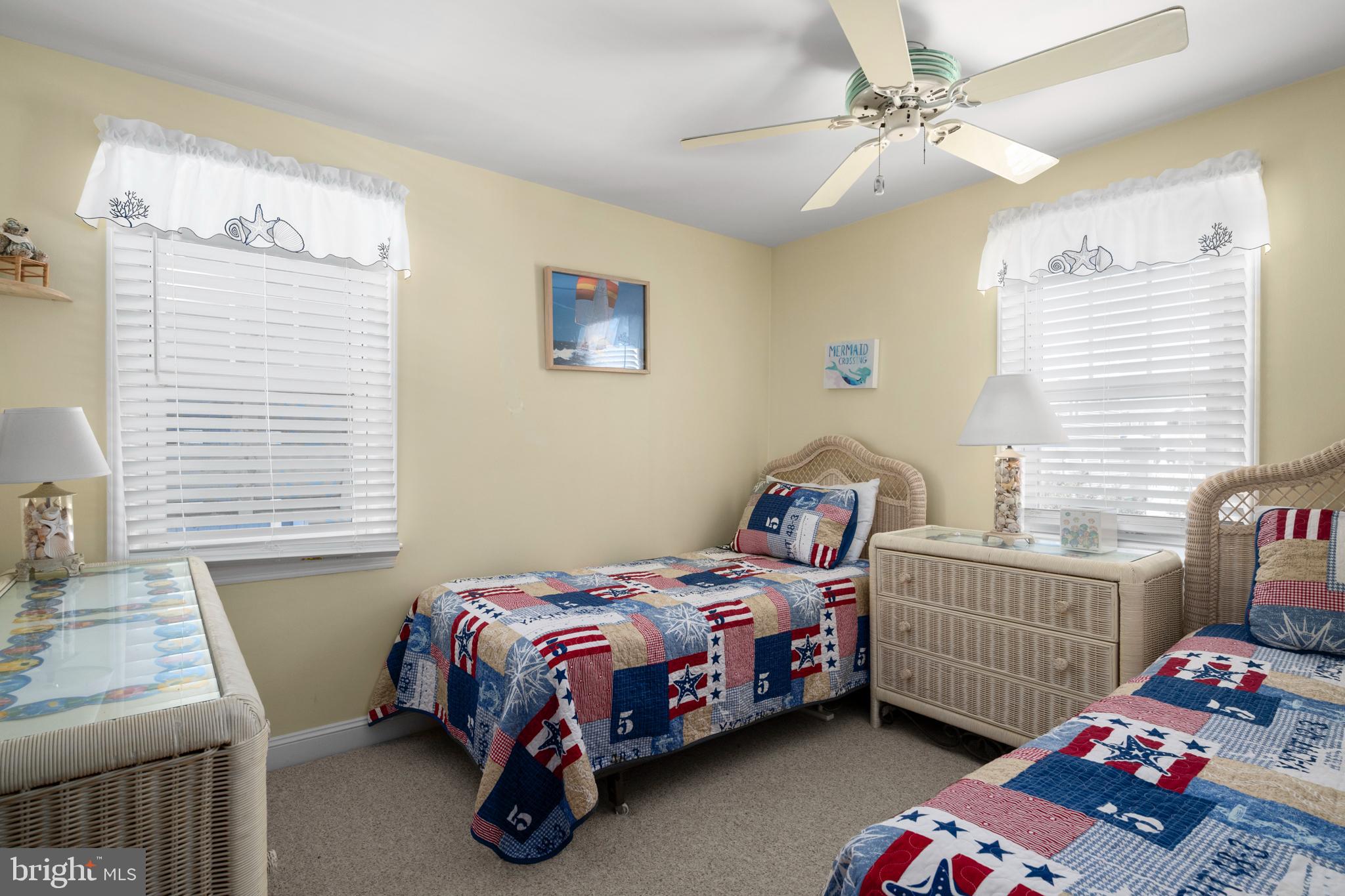 33 19th Street Surf City, NJ 08008 - Photo 32 of 63 a bedroom with a bed a dresser and a window
