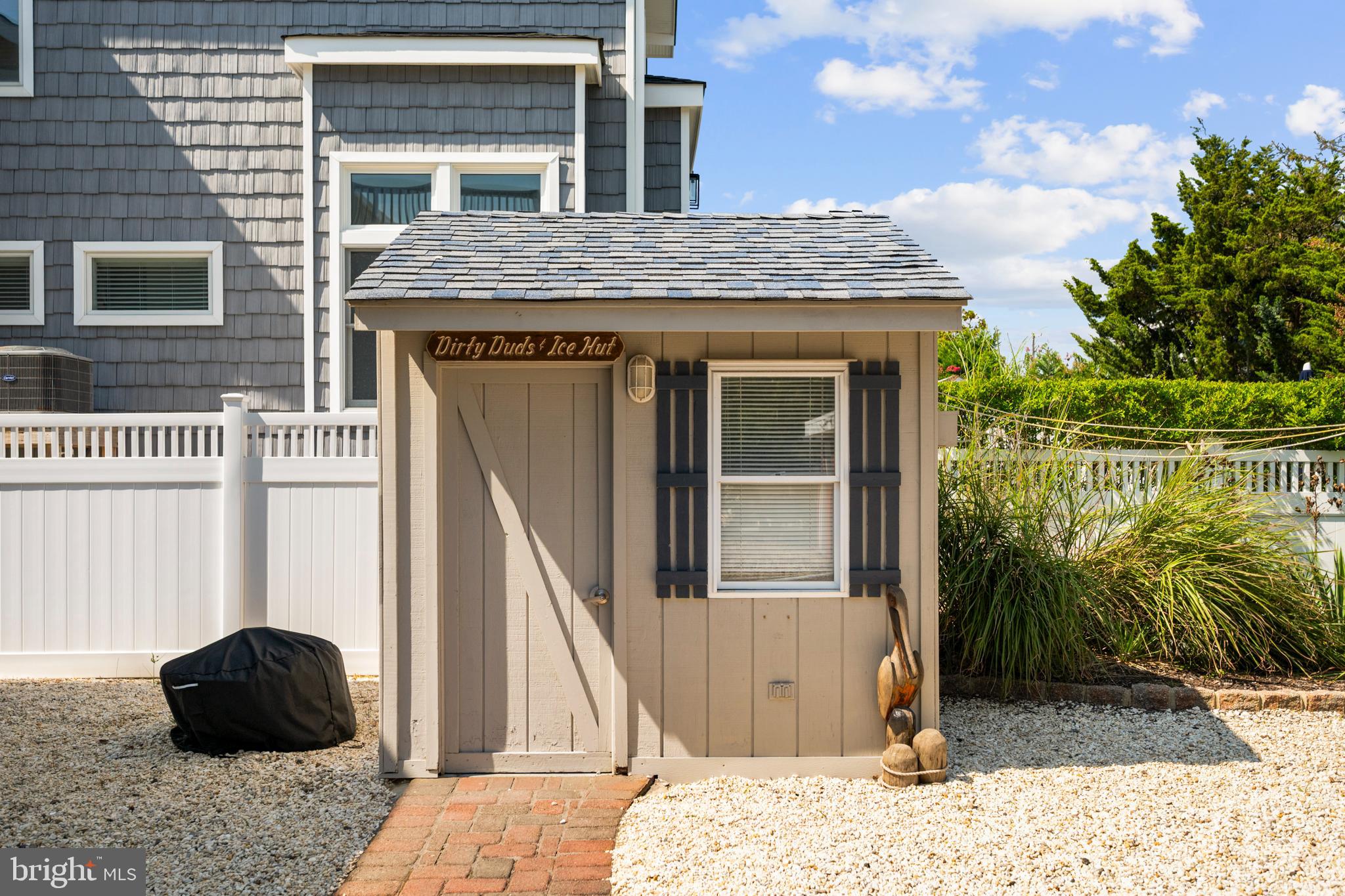 33 19th Street Surf City, NJ 08008 - Photo 41 of 63 a view of a house with a floor to ceiling window and wooden floor