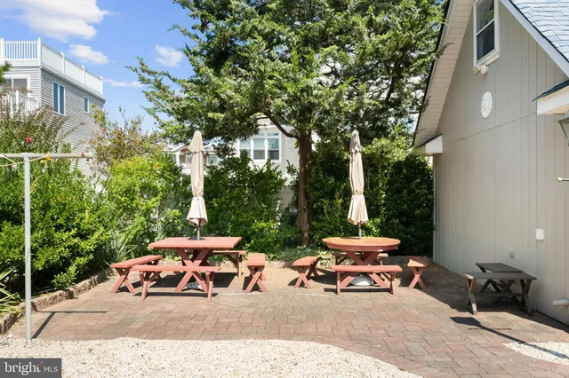 a view of a house with a outdoor space and street view