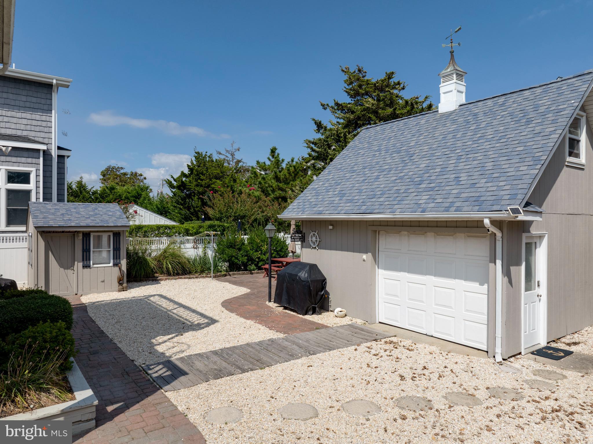 33 19th Street Surf City, NJ 08008 - Photo 45 of 63 a front view of a house with a yard