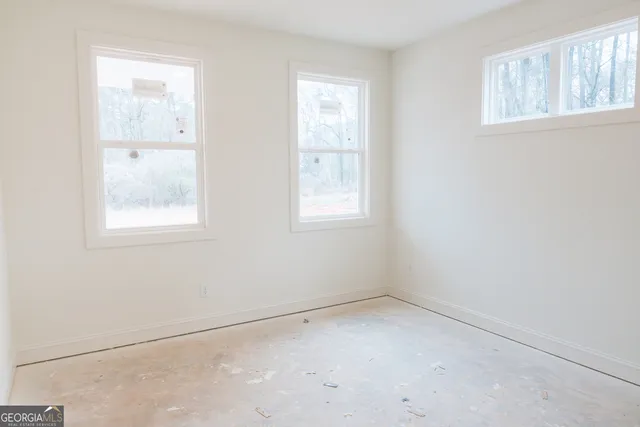 a bathroom with a granite countertop sink a toilet and bathtub
