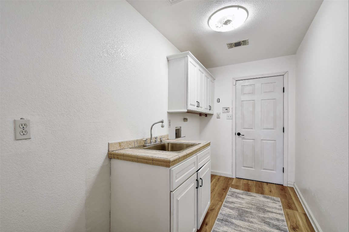 1265 Bob White Drive Spring Branch, TX 78070 - Photo 12 of 25 a bathroom with a sink and a mirror