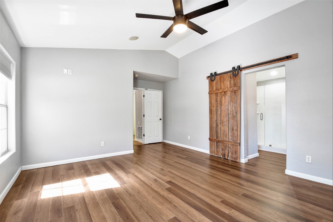 1265 Bob White Drive Spring Branch, TX 78070 - Photo 14 of 25 an empty room with wooden floor and windows