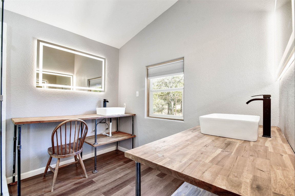 1265 Bob White Drive Spring Branch, TX 78070 - Photo 15 of 25 a view of a workspace with furniture and a window