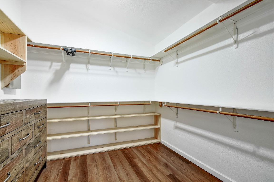 1265 Bob White Drive Spring Branch, TX 78070 - Photo 17 of 25 a view of walk in closet with empty racks