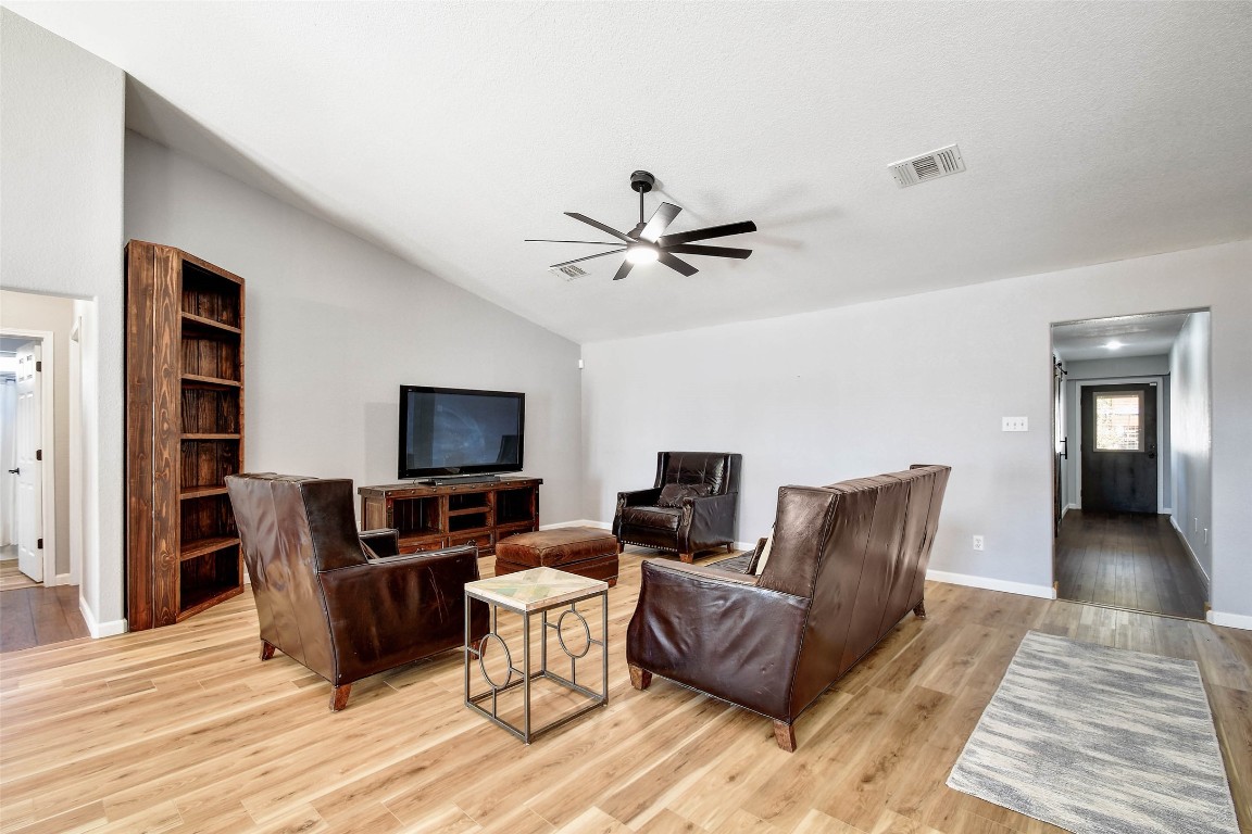 1265 Bob White Drive Spring Branch, TX 78070 - Photo 9 of 25 a living room with furniture and a flat screen tv