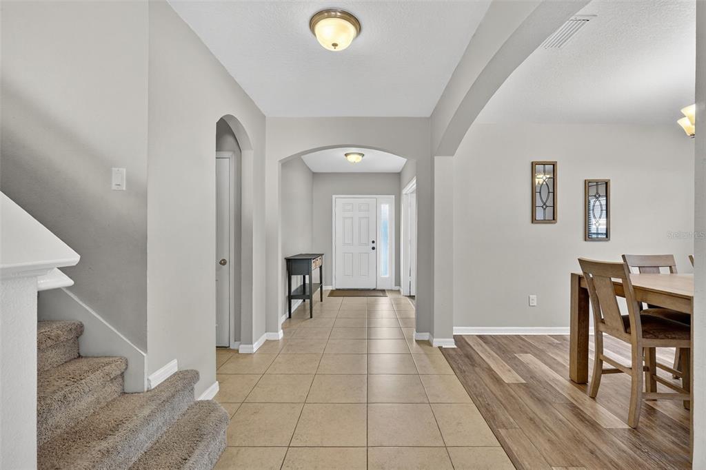 11214 Carrick Stone Street Wimauma, FL 33598 - Photo 13 of 73 a view of a livingroom with furniture and an entryway
