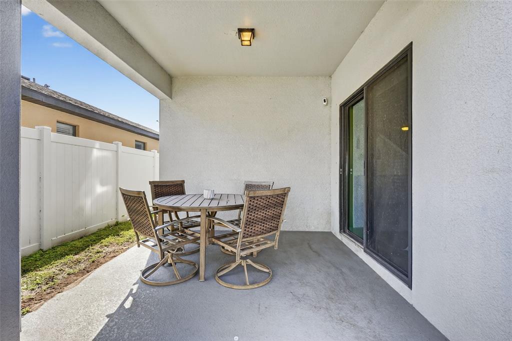 11214 Carrick Stone Street Wimauma, FL 33598 - Photo 52 of 73 a view of a dining room with furniture and window