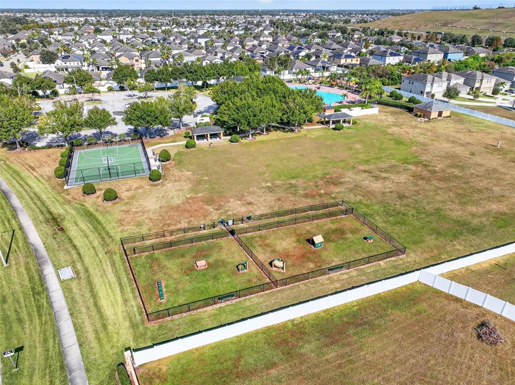 11214 Carrick Stone Street Wimauma, FL 33598 - Photo 55 of 73 an aerial view of residential houses with outdoor space