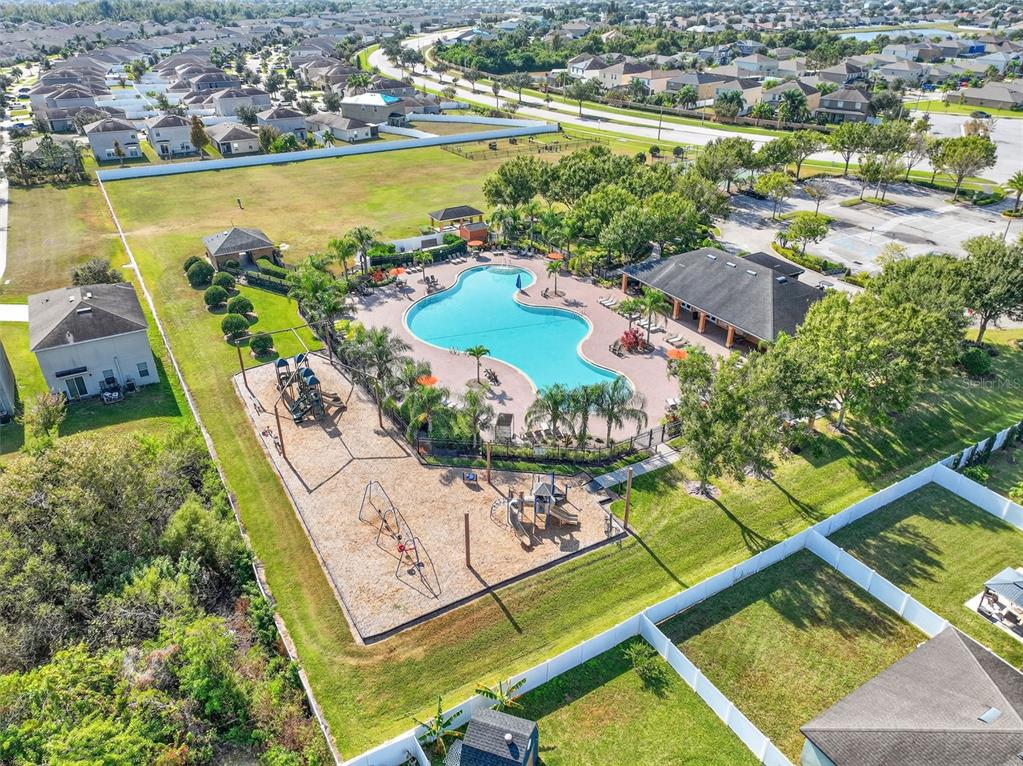 11214 Carrick Stone Street Wimauma, FL 33598 - Photo 59 of 73 an aerial view of a residential houses with outdoor space and ocean view