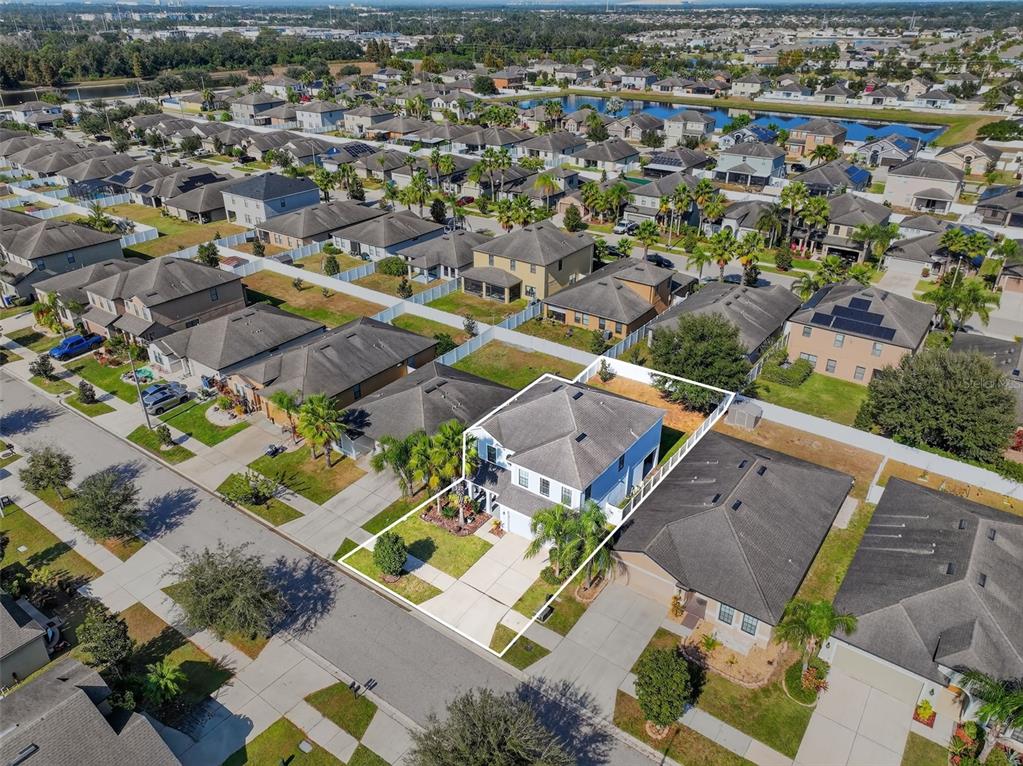 11214 Carrick Stone Street Wimauma, FL 33598 - Photo 61 of 73 an aerial view of residential houses with outdoor space