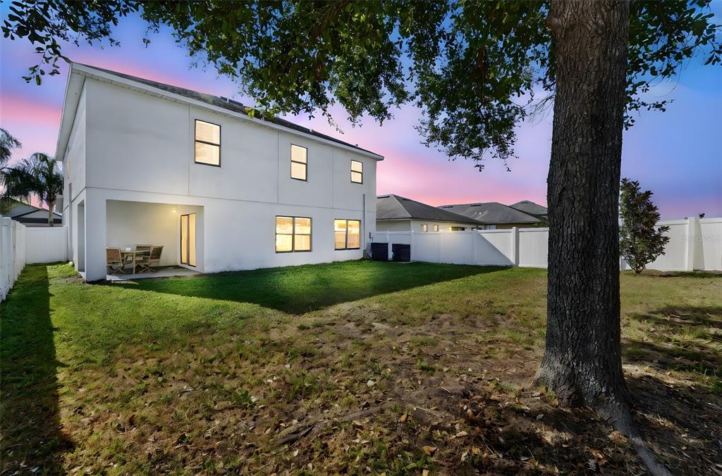 11214 Carrick Stone Street Wimauma, FL 33598 - Photo 73 of 73 a front view of a house with garden