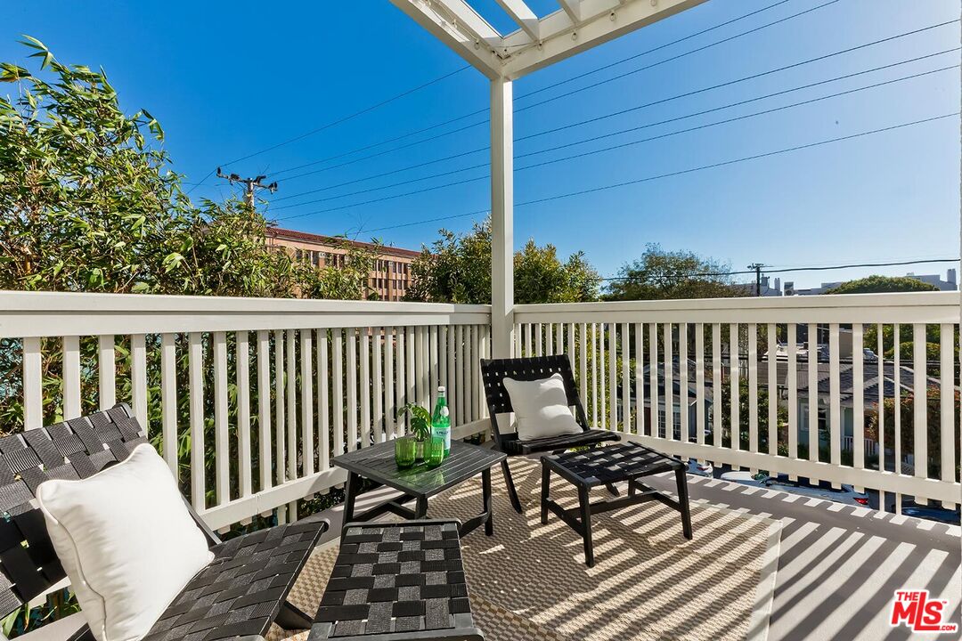 3002 3rd Street, Unit 203 Santa Monica, CA 90405 - Photo 16 of 44 a view of a balcony with wooden floor