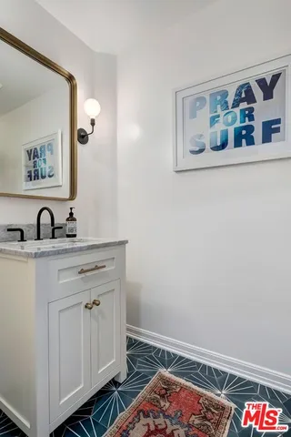 a kitchen with a stove a sink and a refrigerator