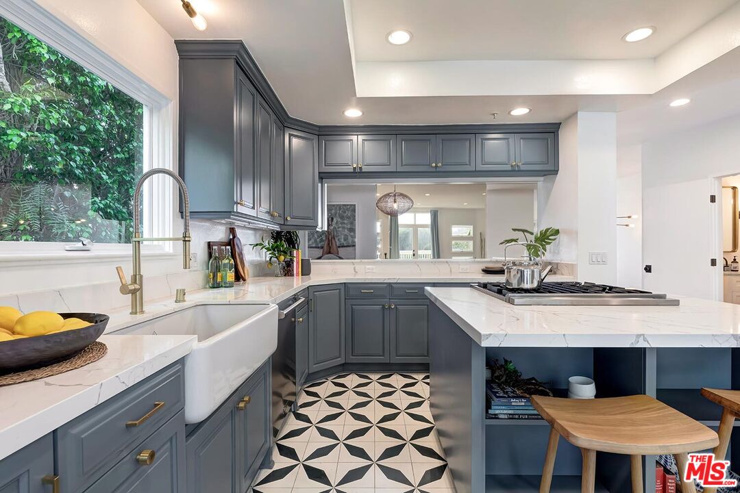 3002 3rd Street, Unit 203 Santa Monica, CA 90405 - Photo 23 of 44 a kitchen with a sink and cabinets