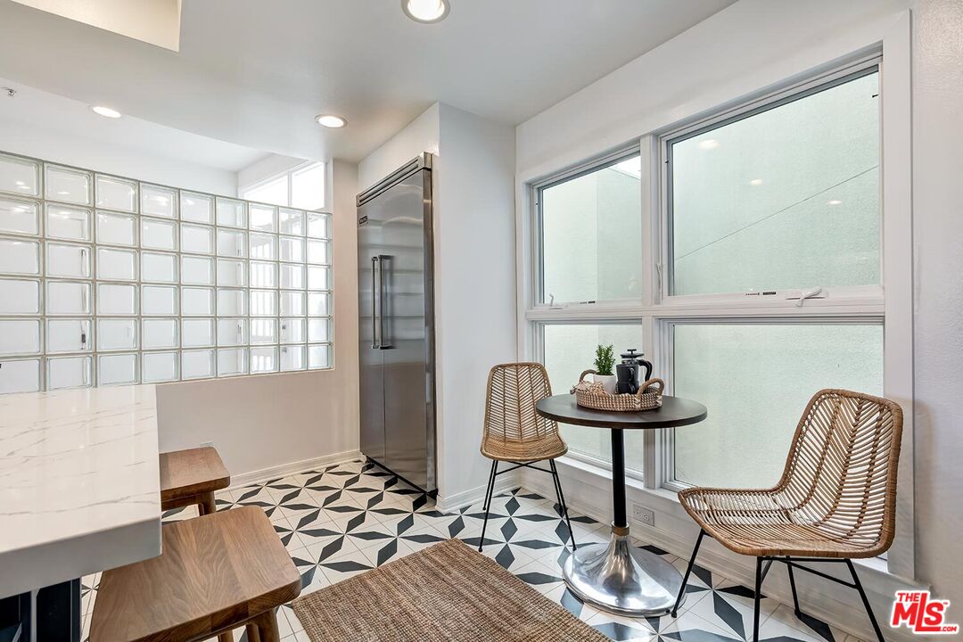 3002 3rd Street, Unit 203 Santa Monica, CA 90405 - Photo 24 of 44 a view of a workspace with furniture and a window