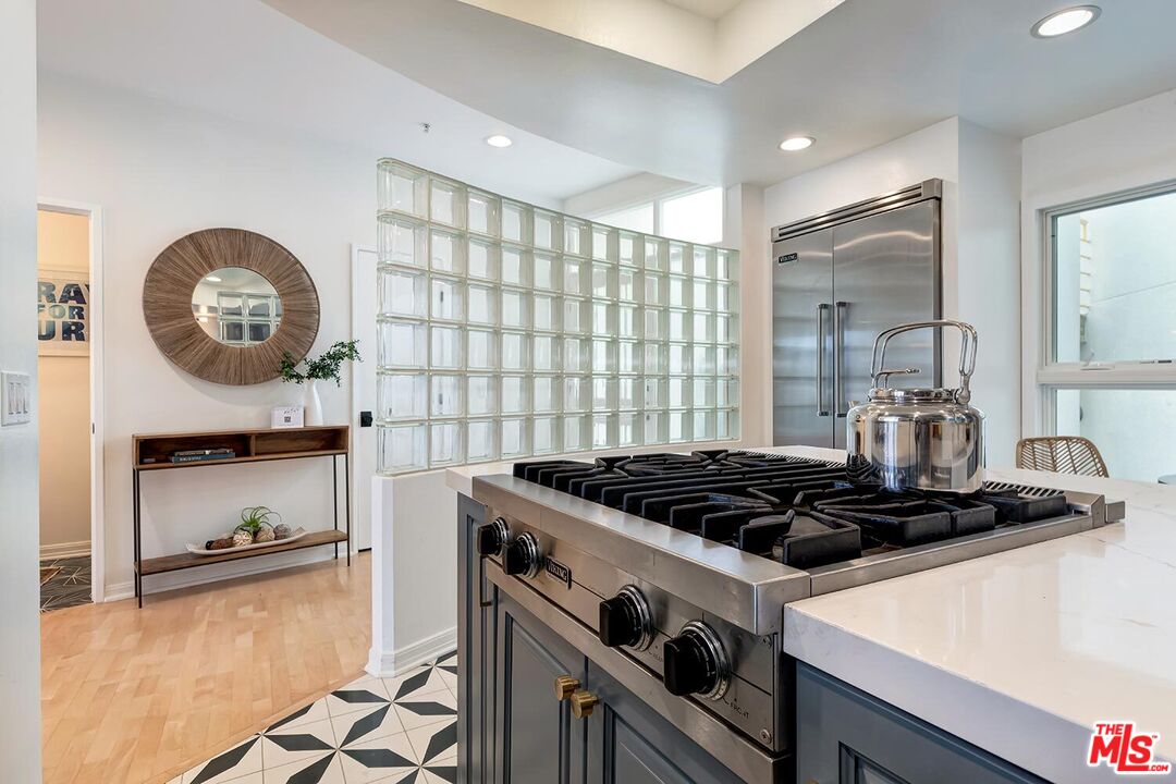 3002 3rd Street, Unit 203 Santa Monica, CA 90405 - Photo 25 of 44 a kitchen with a stove and a sink