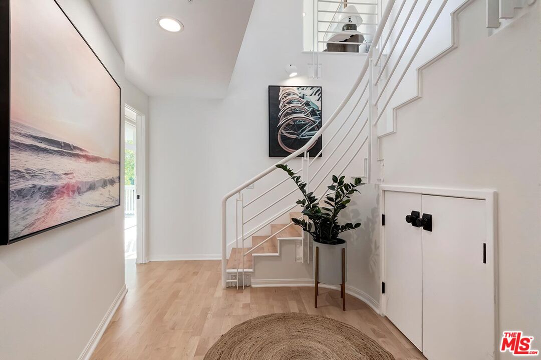 3002 3rd Street, Unit 203 Santa Monica, CA 90405 - Photo 27 of 44 a view of entryway and hall with wooden floor