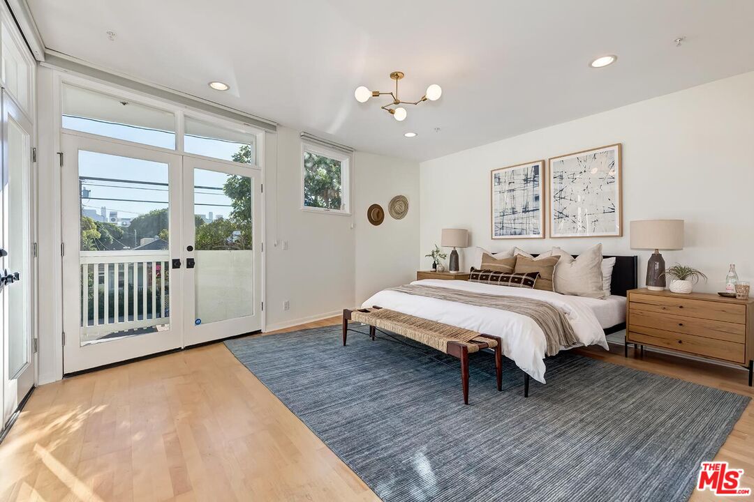 3002 3rd Street, Unit 203 Santa Monica, CA 90405 - Photo 29 of 44 a bed room with a bed and a large window