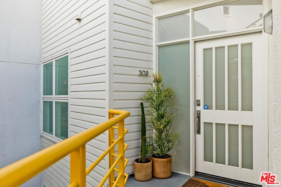 3002 3rd Street, Unit 203 Santa Monica, CA 90405 - Photo 3 of 44 a view of balcony with potted plant