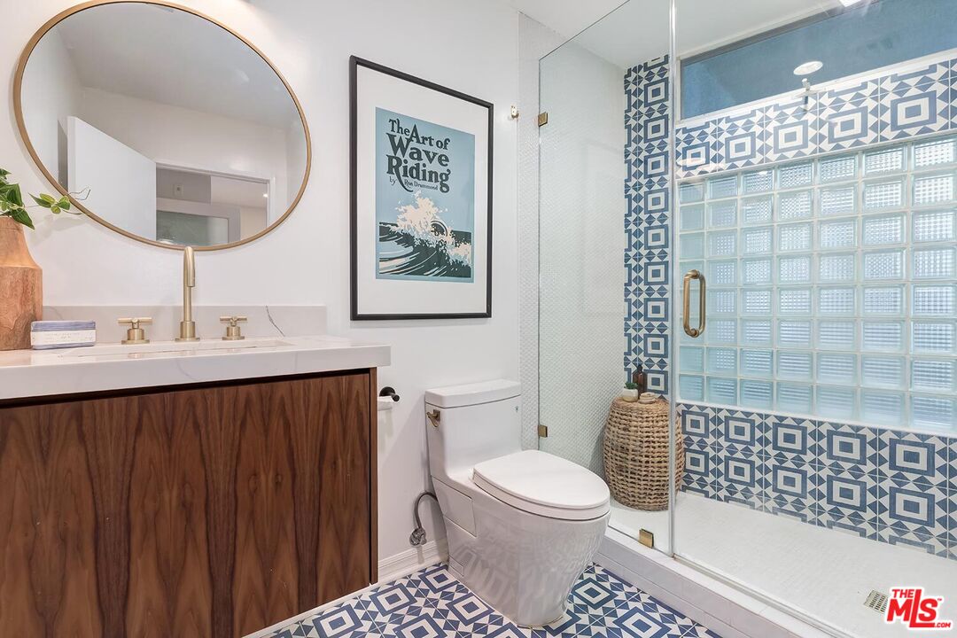 3002 3rd Street, Unit 203 Santa Monica, CA 90405 - Photo 40 of 44 a bathroom with a sink toilet and shower