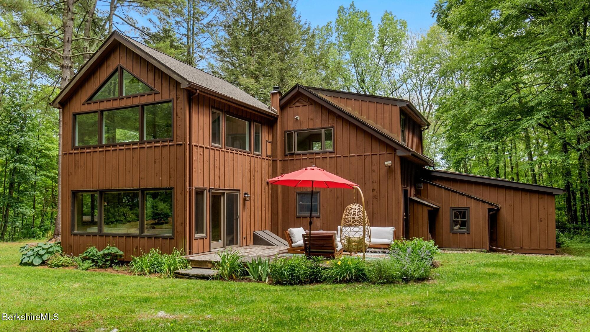 a front view of a house with a yard and porch