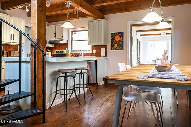 a kitchen with a stove a sink and a refrigerator