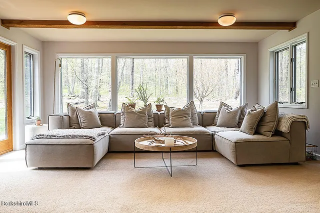 a bedroom with bed and a window