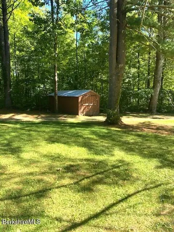 a backyard of a house with seating space