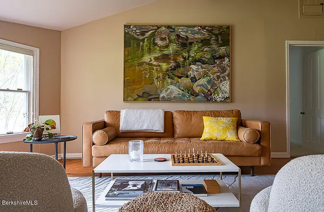 a living room with furniture and a rug