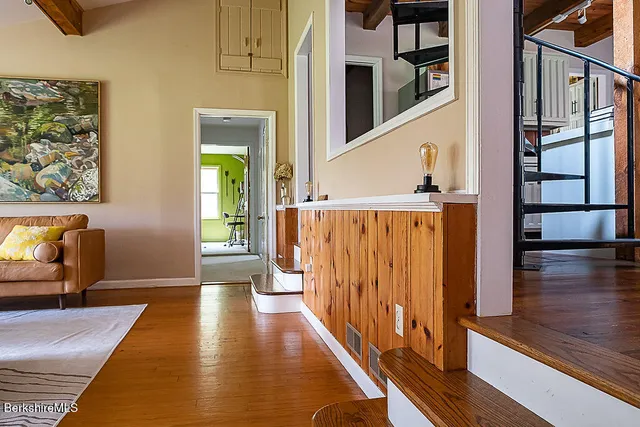 a view of a entryway door with wooden floor