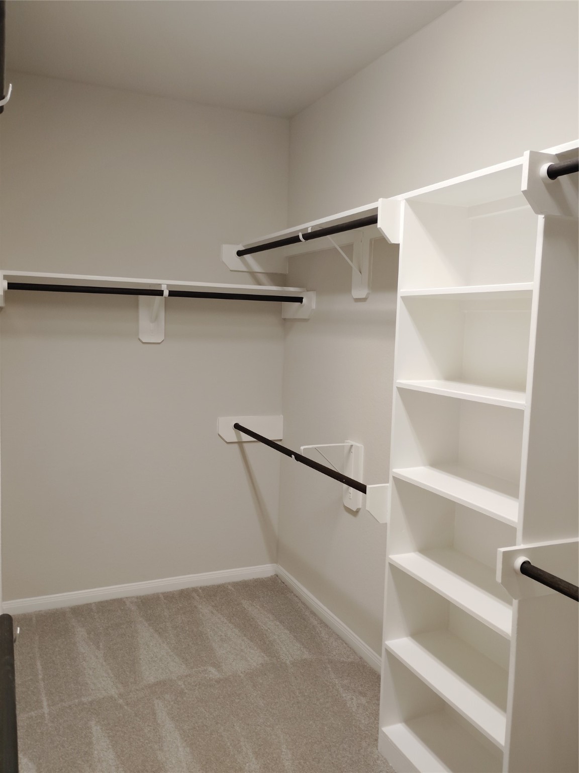 85 Carmel Drive Manvel, TX 77578 - Photo 11 of 31 a view of an empty walk in closet