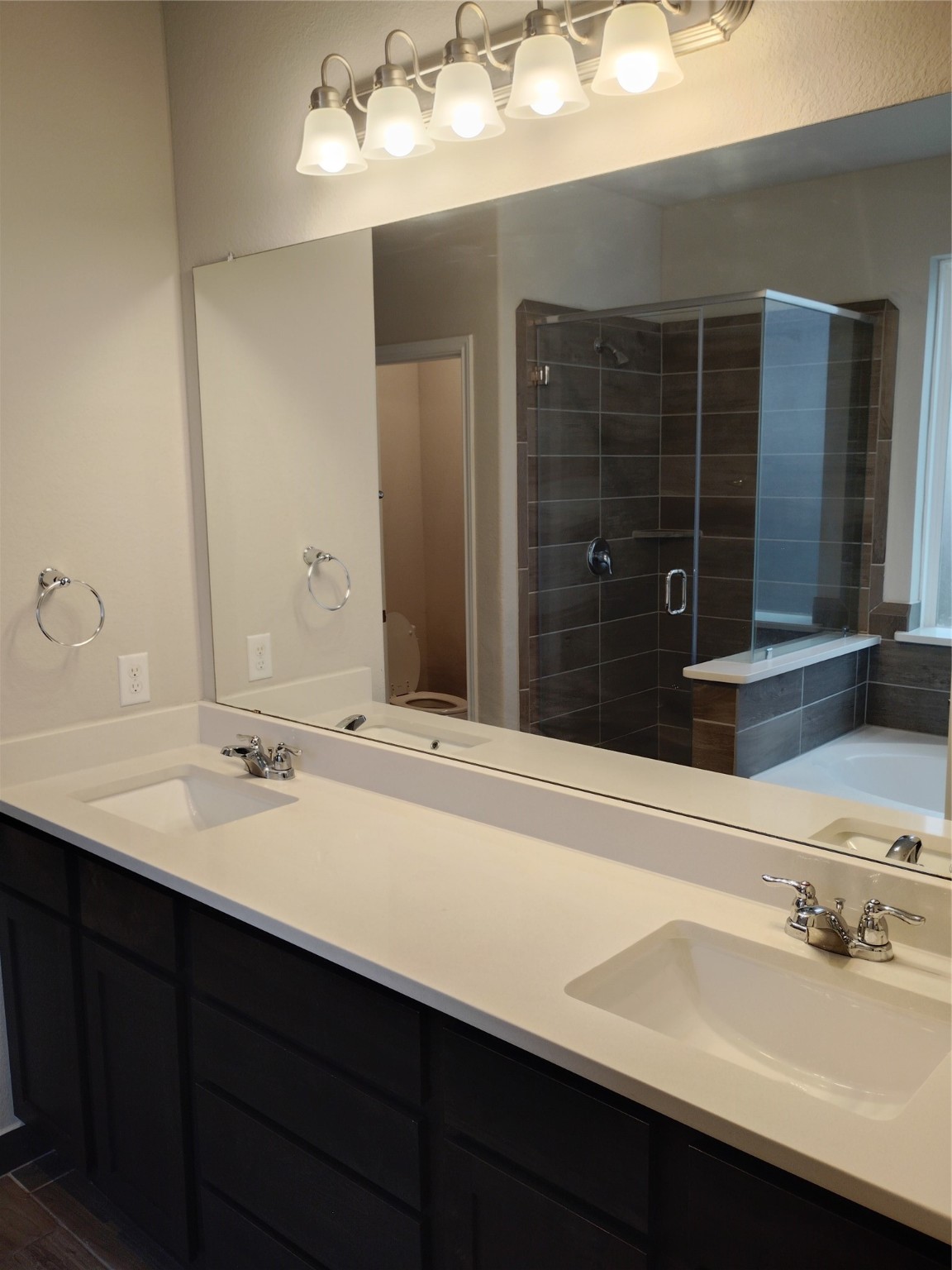 85 Carmel Drive Manvel, TX 77578 - Photo 12 of 31 a bathroom with a sink and a mirror