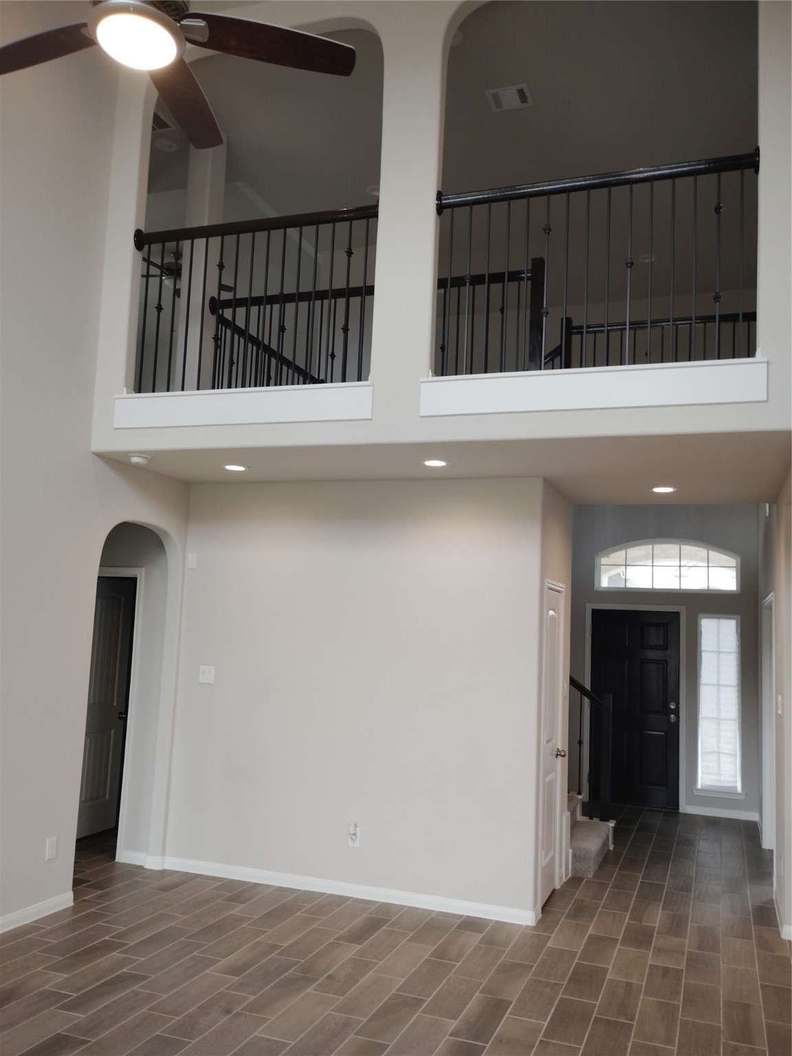 85 Carmel Drive Manvel, TX 77578 - Photo 18 of 31 a view of entryway with a floor to ceiling window and stairs