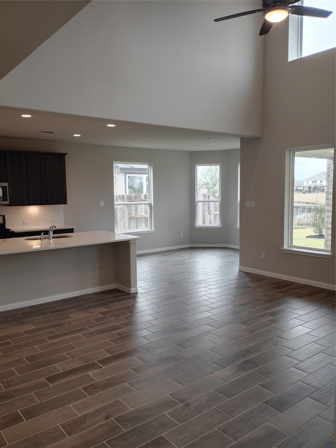 85 Carmel Drive Manvel, TX 77578 - Photo 20 of 31 an empty room with wooden floor and windows