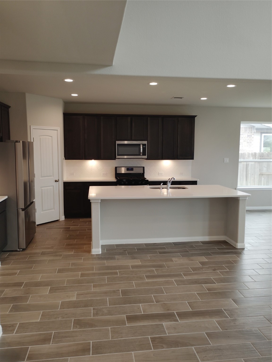 85 Carmel Drive Manvel, TX 77578 - Photo 21 of 31 a view of kitchen with stainless steel appliances kitchen island